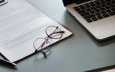 Tricon Commodities Close Up Of Contract And Glasses